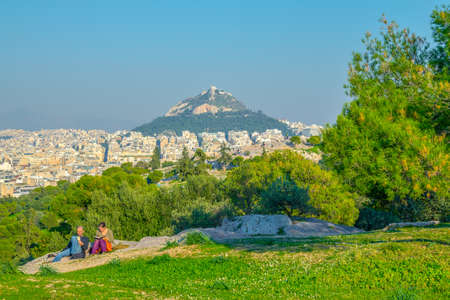 ATHENS, GREECE, DECEMBER 10, 2015: people are having a picnic on philipoppou hill with view on lycabetus hill in athnesのeditorial素材