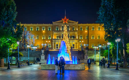 ATHENS, GREECE, DECEMBER 10, 2015: Syntagma square with parliament building at the end in Athens decorated for Christmasのeditorial素材