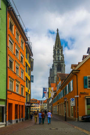 KONSTANZ, GERMANY, JULY 24, 2016: View of a narrow street with cathedral at ist end in Konstanz in...