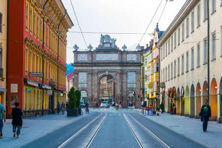 INNSBRUCK, AUSTRIA, JULY 26, 2016: People are passing by the Triumphpforte in Innsbruck, Austria.のeditorial素材