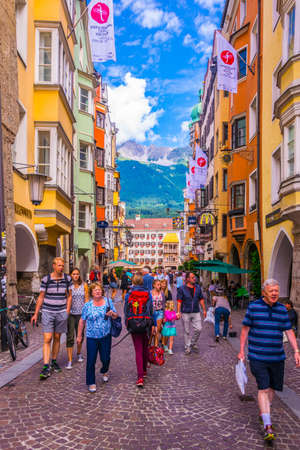 INNSBRUCK, AUSTRIA, JULY 27, 2016: People are wandering through Herzog Friedrich strasse street connecting the Goldenes Dachl with the town square in Innsbruck, Austria.のeditorial素材