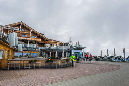 ZELL AM SEE, AUSTRIA, JULY 29, 2016: people are enjoying view over zell am see and the zeller lake in Austria from the upper station of the Schmmitenhohe cable car.のeditorial素材