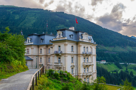 BAD GASTEIN, AUSTRIA, JULY 29, 2016: View of a yellow hotel in the austrian spa and ski resort bad gastein.のeditorial素材