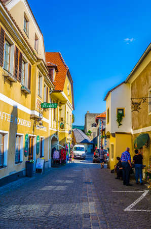 DURNSTEIN, AUSTRIA, MAY 16, 2015: flocks of tourists are passing by narrow streets of the medieval town of Durnstein along the Danube River in the picturesque Wachau Valleyのeditorial素材