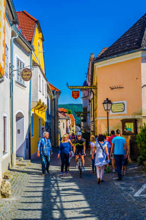 DURNSTEIN, AUSTRIA, MAY 16, 2015: flocks of tourists are passing by narrow streets of the medieval town of Durnstein along the Danube River in the picturesque Wachau Valleyのeditorial素材