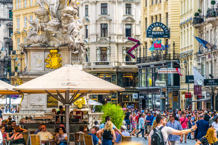 VIENNA, AUSTRIA, JUNE 2016: People are enjoying sunny day in cafe next to the memorial Plague column (Pestsaule) on Graben street in Vienna.のeditorial素材