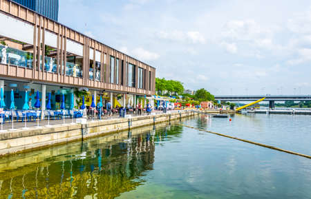 VIENNA, AUSTRIA, JUNE 2016: View of restaurants on the shore of donau river near VIC and Donauturm in Vienna, Austria.のeditorial素材