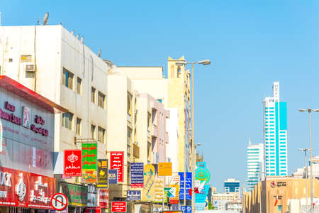 AL MUHARRAQ, BAHRAIN, OCTOBER 22, 2016: View of advertisement signs on a street in Al Muharraq,...