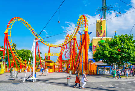 VIENNA, AUSTRIA, JUNE 2016: View of an orange roller coaster situated inside of the prater amusement...