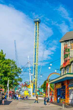 VIENNA, AUSTRIA, JUNE 2016: People are walking through grounds of the prater amusement park in...