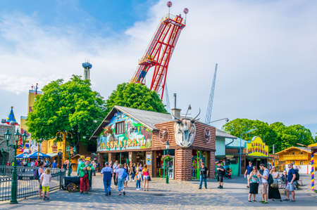 VIENNA, AUSTRIA, JUNE 2016: People are walking through grounds of the prater amusement park in...