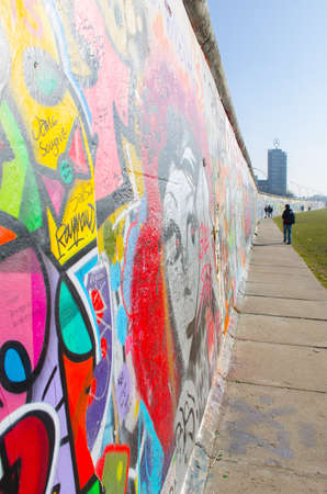 BERLIN, GERMANY, MARCH 12, 2015: various paintings are decorating remnants of the former berlin wall at nowadays east side gallery.のeditorial素材