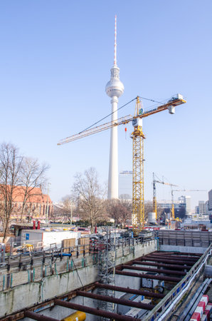 BERLIN, GERMANY, MARCH 12, 2015: construction site of a new subway line in berlin situated in the middle part of the city with view of berlin cathedral and fernsehturm.のeditorial素材