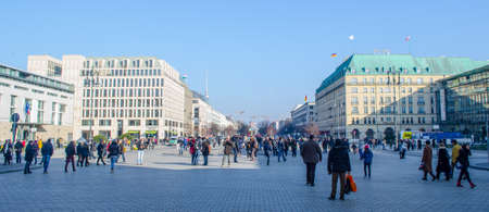 BERLIN, GERMANY, MARCH 12, 2015: people are walking in front of the main symbol of berlin - brandenburger tor.のeditorial素材