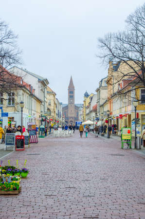 POTSDAM, GERMANY, MARCH 11, 2015: main alley in potsdam - brandenburger strasse. At one end is situated brandenburger tor and at the second saint peter and paul church.のeditorial素材