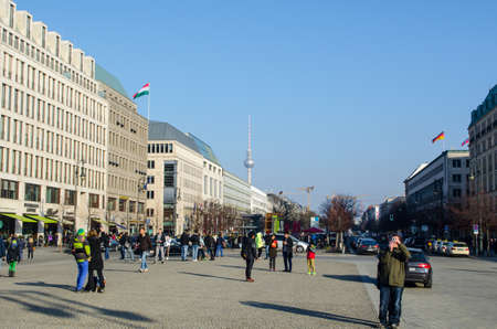BERLIN, GERMANY, MARCH 12, 2015: people are walking in front of the main symbol of berlin - brandenburger tor.のeditorial素材