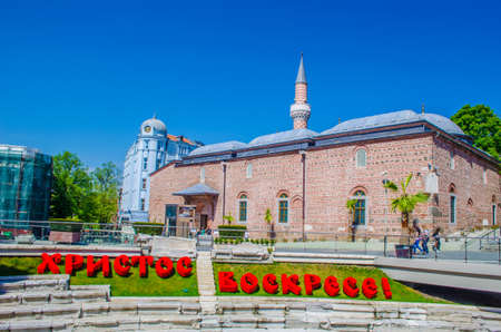 PLOVDIV, BULGARIA, APRIL 7, 2015: Ruins of antique stadium under the main boulevard in bulgarian city plovdiv are uncovered on a small square between shops, restaurants and mosque.のeditorial素材