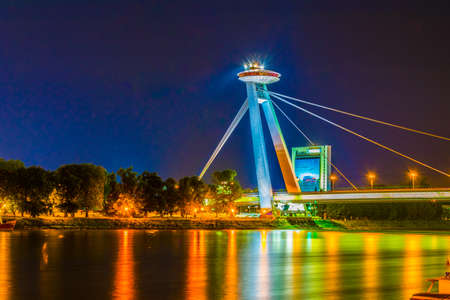 BRATISLAVA, SLOVAKIA, MAY 28, 2016: Night view of the illuminated SNP bridge over Danube in Bratislavaのeditorial素材