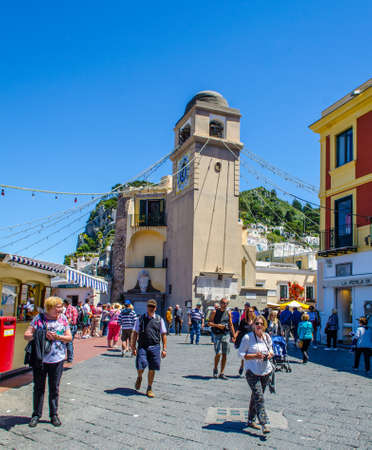 CAPRI, ITALY, MAY 18, 2014: people are passing by through the historical center of capri town situated in the bay of naples.のeditorial素材