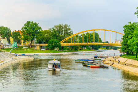 GYOR, HUNGARY MAY 20, 2016: a tour boat is driving tourists on the raba river in the hungarian city gyorのeditorial素材