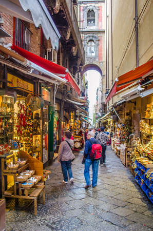 NAPLES, ITALY, MAY 8, 2014: People are passing by through narrow streets of historical old town in italian naples.のeditorial素材