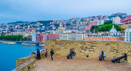 NAPLES, ITALY, MAY 14, 2014: people are passing around of the Castel dell'Ovo (Egg Castle) a medieval fortress in the bay of Naples, Italyのeditorial素材