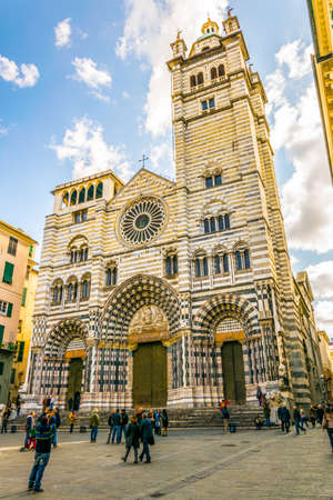 GENOA, ITALY, MARCH 13, 2016: people are walking in front of the cathedral of saint lorenzo in the italian city genoaのeditorial素材