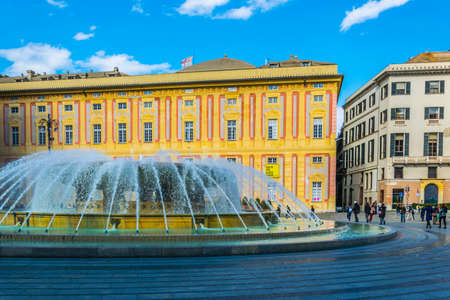 GENOA, ITALY, MARCH 13, 2016: people are enjoying sunny day on the square raffaele de ferrari in front of the palazzo ducale Genoa, Italyのeditorial素材