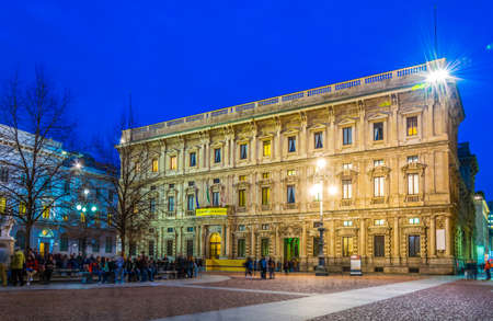 MILANO, ITALY, MARCH 13, 2016: night view of the illuminated Palazzo Marino, home of the city hall council in Milan.のeditorial素材