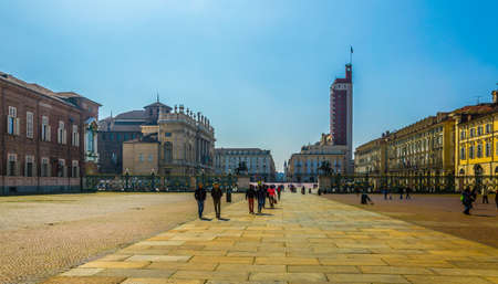 TORINO, ITALY, MARCH 12, 2016: people are strolling through historical buildings of the palazzo reale and castello degli acaja on the castle square in the italian city torino.のeditorial素材