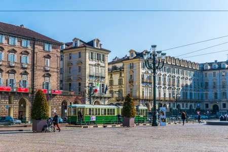 TORINO, ITALY, MARCH 12, 2016: people are strolling through historical buildings of the palazzo reale and castello degli acaja on the castle square in the italian city torino.のeditorial素材