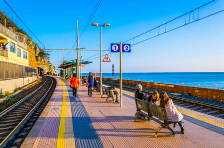 MANAROLA, ITALY, MARCH 13, 2016: people are waiting for a train at the train station in manarola, cinque terre, italyのeditorial素材