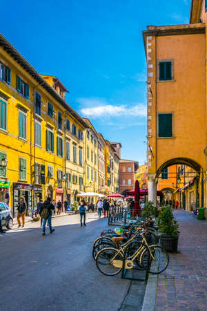 PISA, ITALY, MARCH 14, 2016: people are enjoying sunny day at spring strolling through via guglielmo oberdan in the italian city Pisa.のeditorial素材