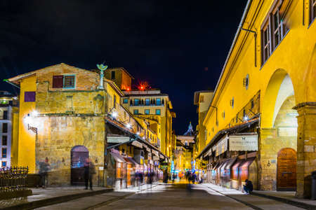FLORENCE, ITALY, MARCH 15, 2016: Night view of the illuminated ponte vecchio bridge in the italian city florenceのeditorial素材