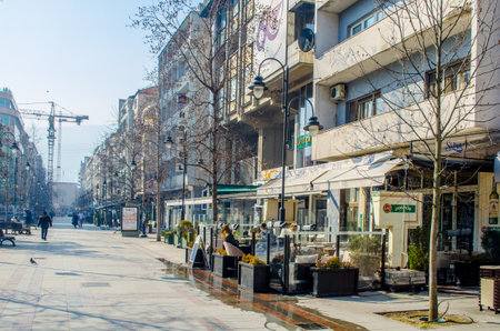 SKOPJE, MACEDONIA, FEBRUARY 16, 2015: people are strolling on macedonia street in macedonian capital skopje during sunny day in ferbuary.のeditorial素材