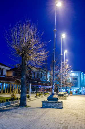 OHRID, MACEDONIA, FEBRUARY 14, 2015: night view over illuminated main shopping alley in the historical center of unesco listed macedonian town ohrid.のeditorial素材