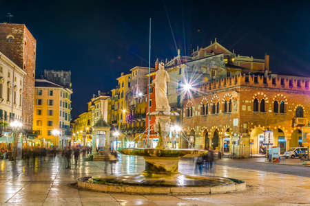 VERONA, ITALY, MARCH 19, 2016: people are strolling through piazza delle erbe in Verona, Italy during nightのeditorial素材