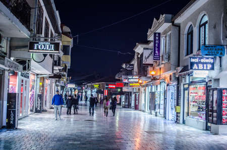 OHRID, MACEDONIA, FEBRUARY 14, 2015: night view over illuminated main shopping alley in the historical center of unesco listed macedonian town ohrid.のeditorial素材