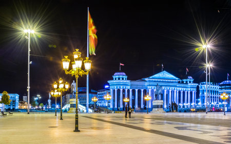 SKOPJE, MACEDONIA, MAY 14, 2016: night view of the stone bridge and archaeological museum in macedonian capital skopje.のeditorial素材