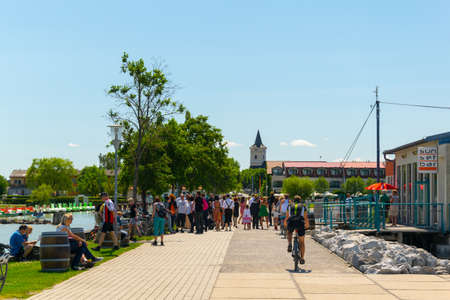 PODERSDORF AM SEE, AUSTRIA, JUNE 17, 2016: View of lakeside promenade of the austrian town podersdorf am see situated on shore of neusiedlersee in Austriaのeditorial素材