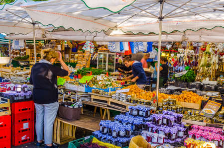 MUNICH, GERMANY, AUGUST 20: People at the Viktualienmarkt in Munich, Germamy. This traditional...