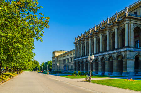 MUNICH, GERMANY, AUGUST 25, 2015: people are walking through a wide alley between hofgarten park and the residenz building in german city munichのeditorial素材
