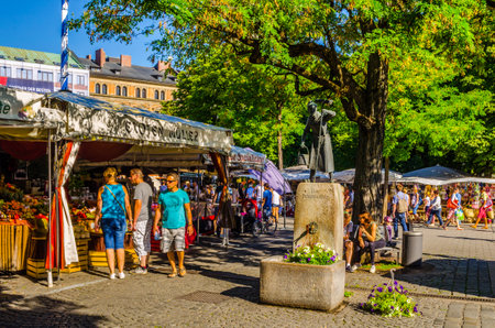 MUNICH, GERMANY, AUGUST 20: People at the Viktualienmarkt in Munich, Germamy. This traditional market takes place every day since 1807.のeditorial素材