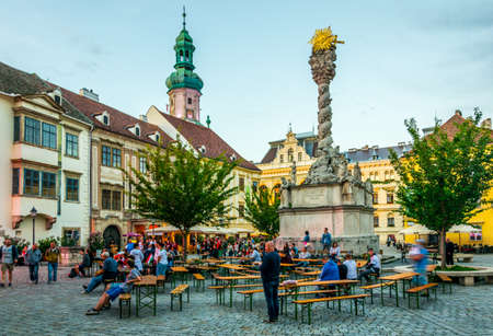 SOPRON, HUNGARY, JUNE 17, 2016: People are gathering on the main square of Sopron - Fo ter - surrounded by several landmarks including the famous fire tower, Hungaryのeditorial素材