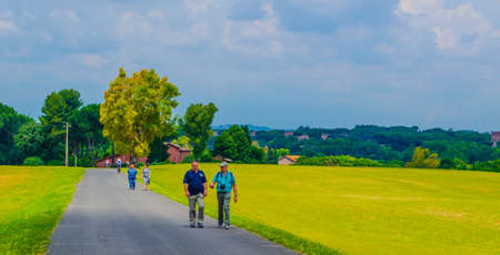 ROME, ITALY, MAY 30, 2014: Couple of tourist is walking down the way to catacombs on ancient via appia way.のeditorial素材