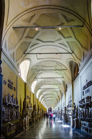 VATICAN, VATICAN, JUNE 1, 2014: People are admiring antic statues in corridor leading through vatican museums.のeditorial素材