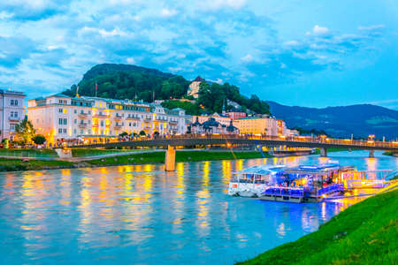 SALZBURG, AUSTRIA, JULY 1, 2016: Riverside of the Salzach river in Salzburg during sunset, Austria.のeditorial素材