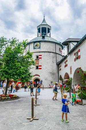 WERFEN, AUSTRIA, JULY 2, 2016: Kids are playing on the main courtyard of the Hohenwerfen castle in Austria.のeditorial素材