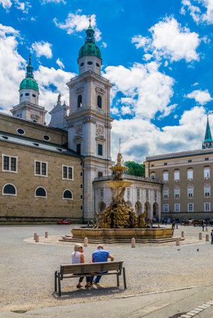 SALZBURG, AUSTRIA, JULY 3, 2016: Beautiful view of Residenzplatz with the cathedral and Residenzbrunnen fountain in the historical part of the Austrian city Salzburg.のeditorial素材