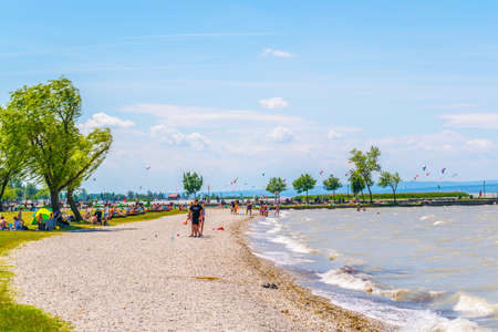 PODERSDORF, AUSTRIA, JULY 9, 2016: People are enjoying day on a beach in Podersdorf am See in Austria.のeditorial素材